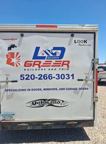 The back of a trailer that says greeer builders and trim