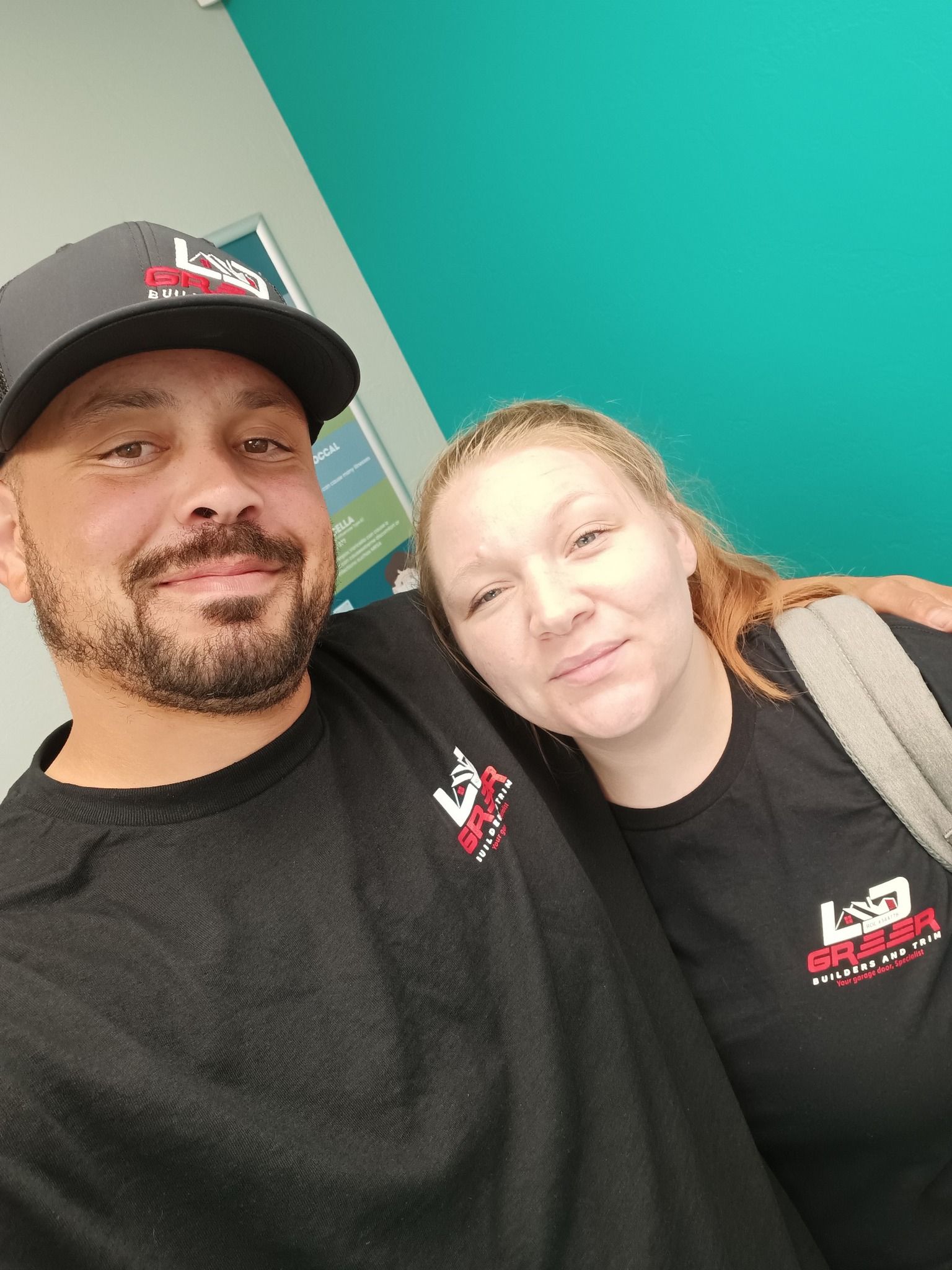 A man and a woman are posing for a picture together.