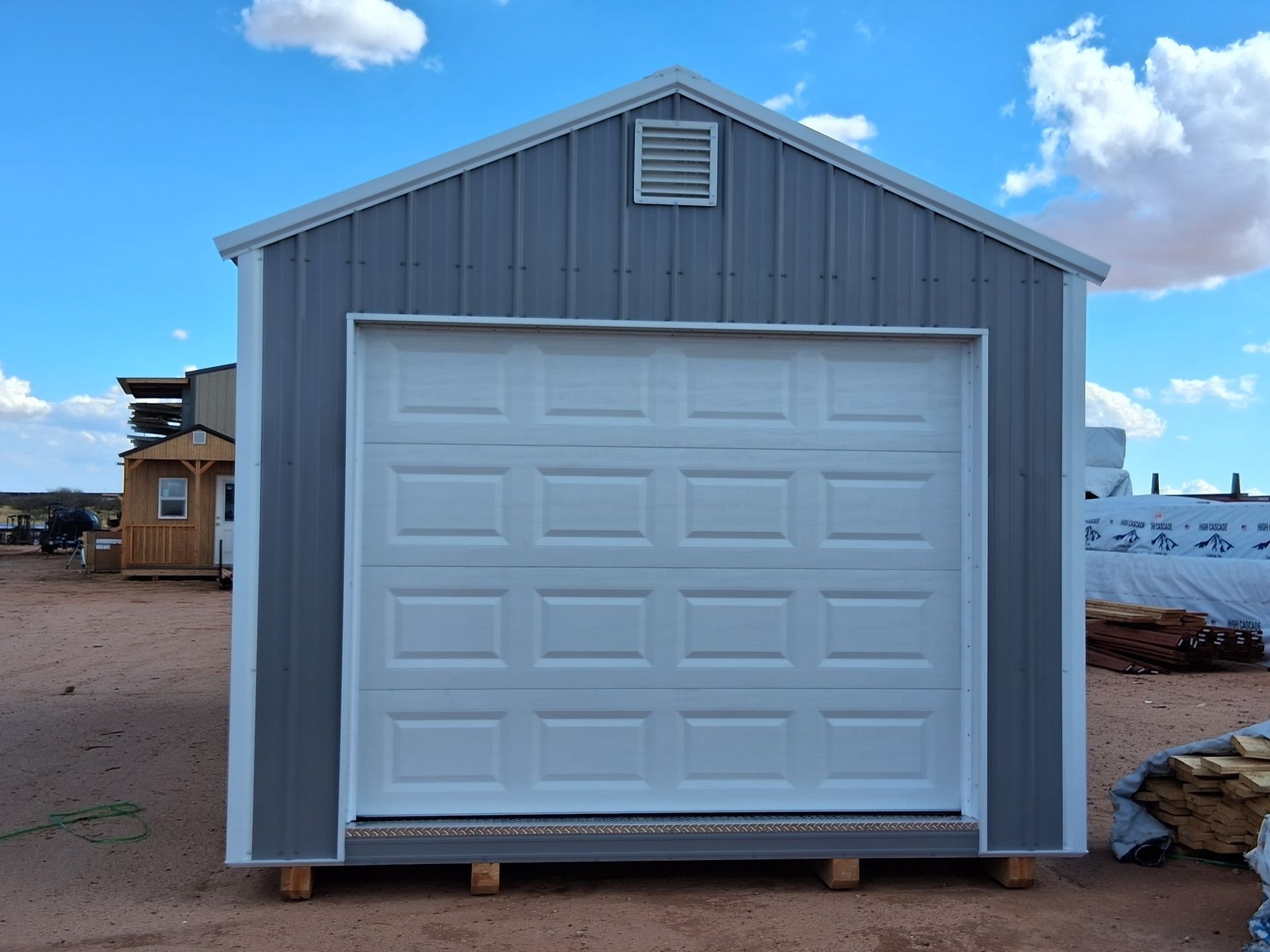 A gray garage with a white garage door