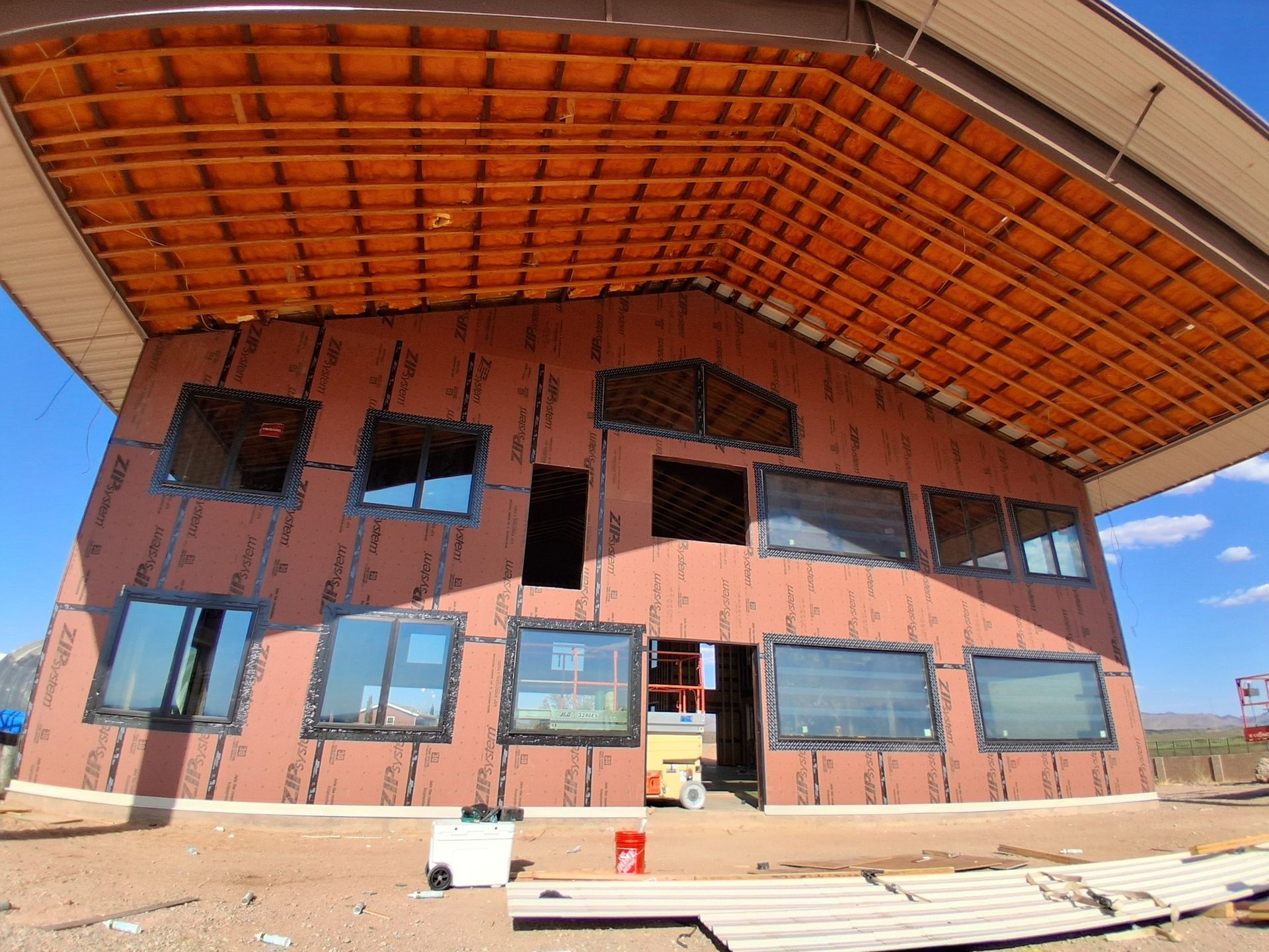 A large building with a lot of windows is under construction