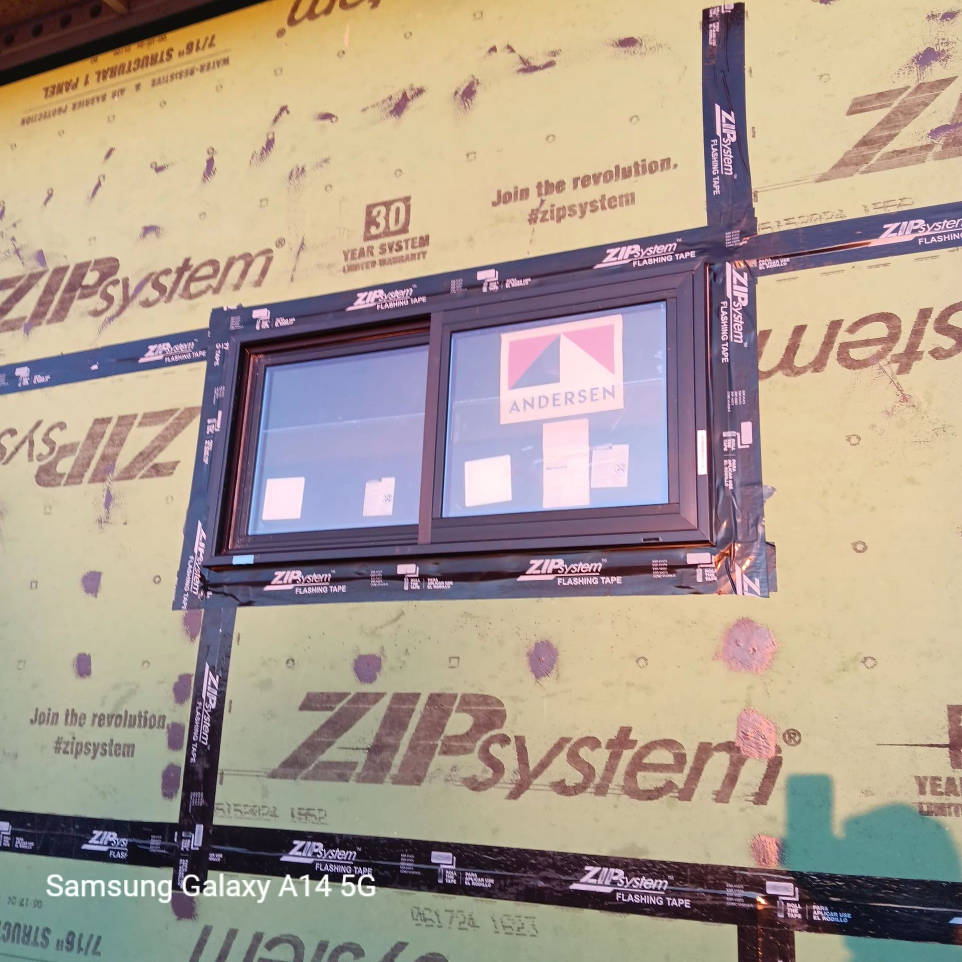 A samsung galaxy a14 5g takes a picture of a zipsystem window
