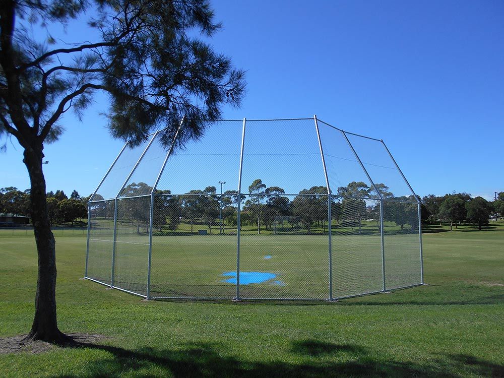 A Baseball Field With a Fence and a Tree in the Foreground — Rearden Fencing Pty Ltd in Toronto, NSW