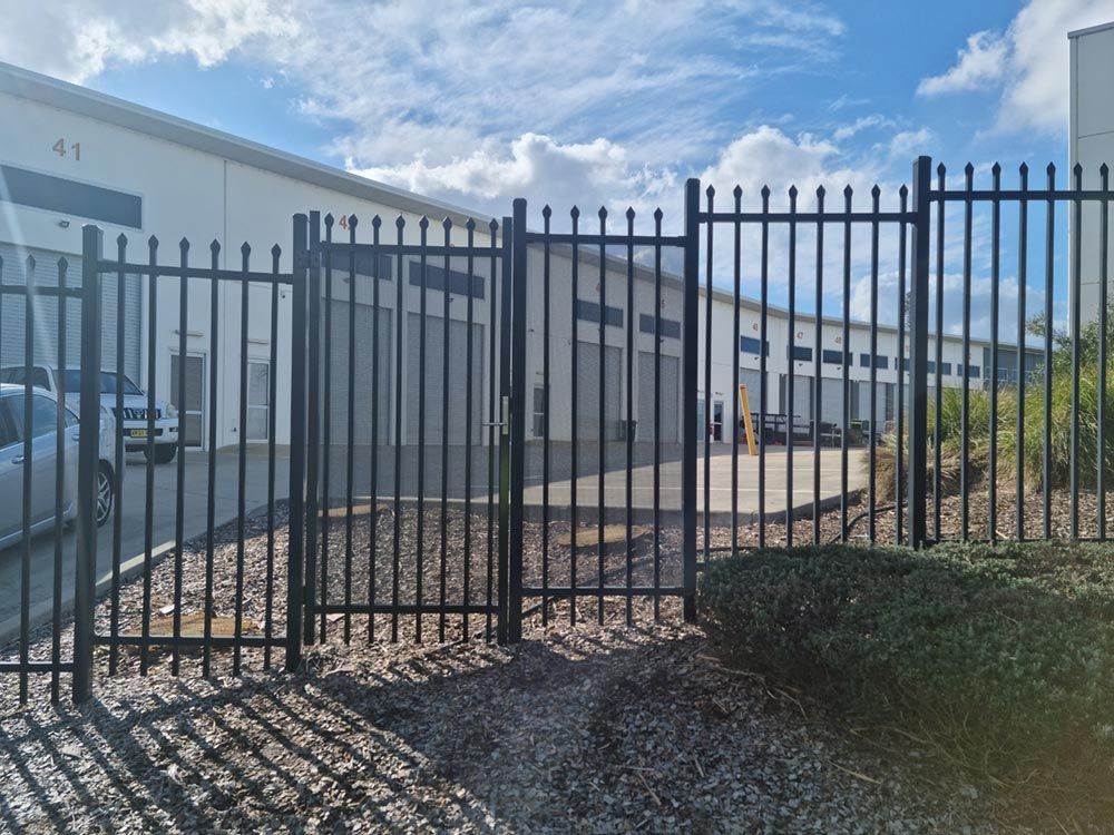 Crushed Spear Security Gate with Kaba Lock and Perforated Mesh — Rearden Fencing Pty Ltd in Toronto, NSW
