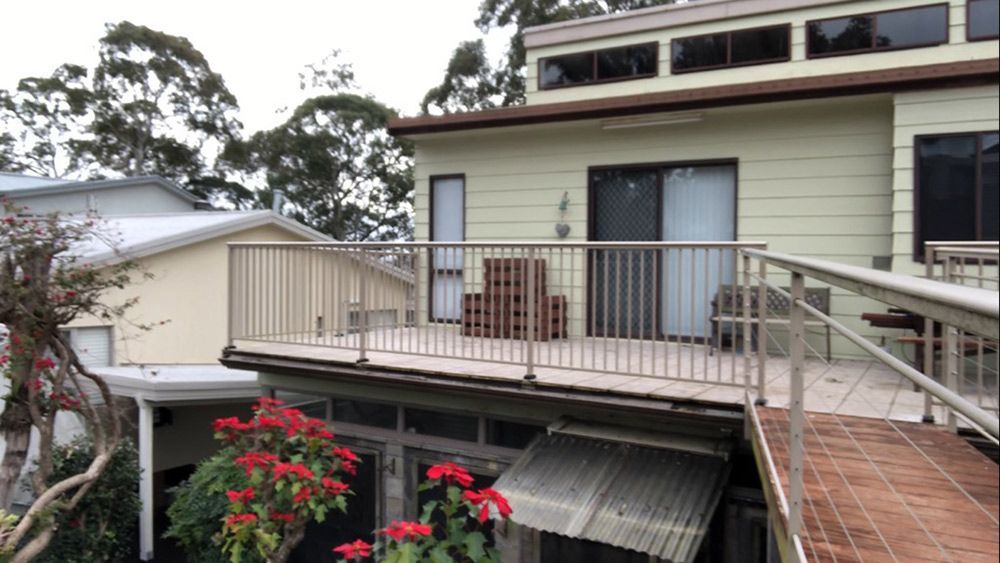 There is a Balcony on the Side of a House — Rearden Fencing Pty Ltd in Toronto, NSW