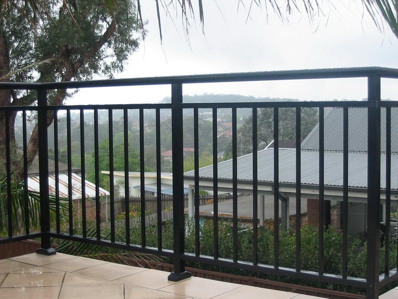 A Balcony With a View of a House and Trees — Rearden Fencing Pty Ltd in Toronto, NSW