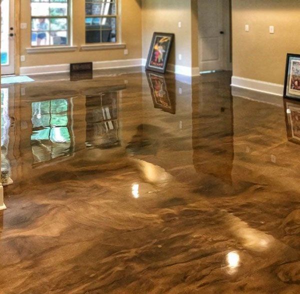 A room with a marble floor and a mirrored wall