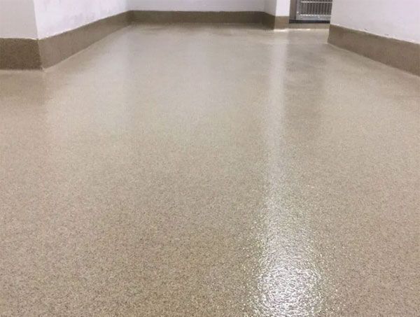 A close up of a beige floor in a room.