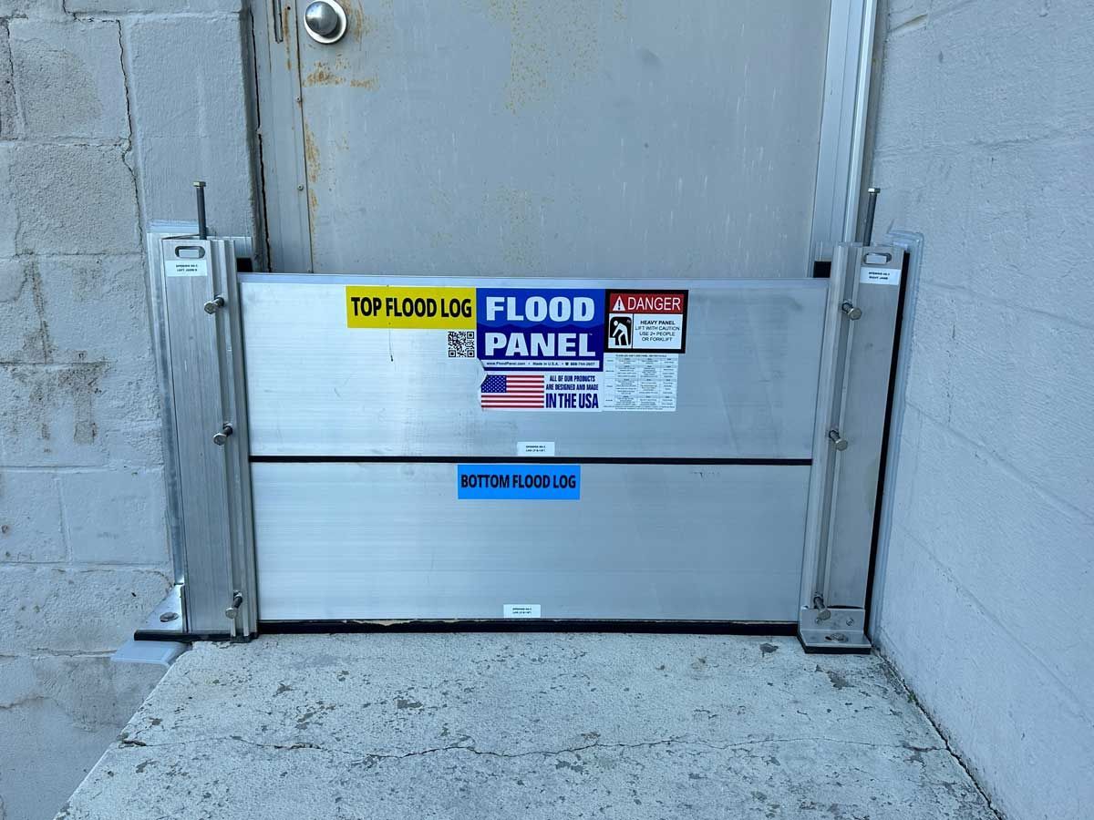 A flood panel is attached to the side of a door