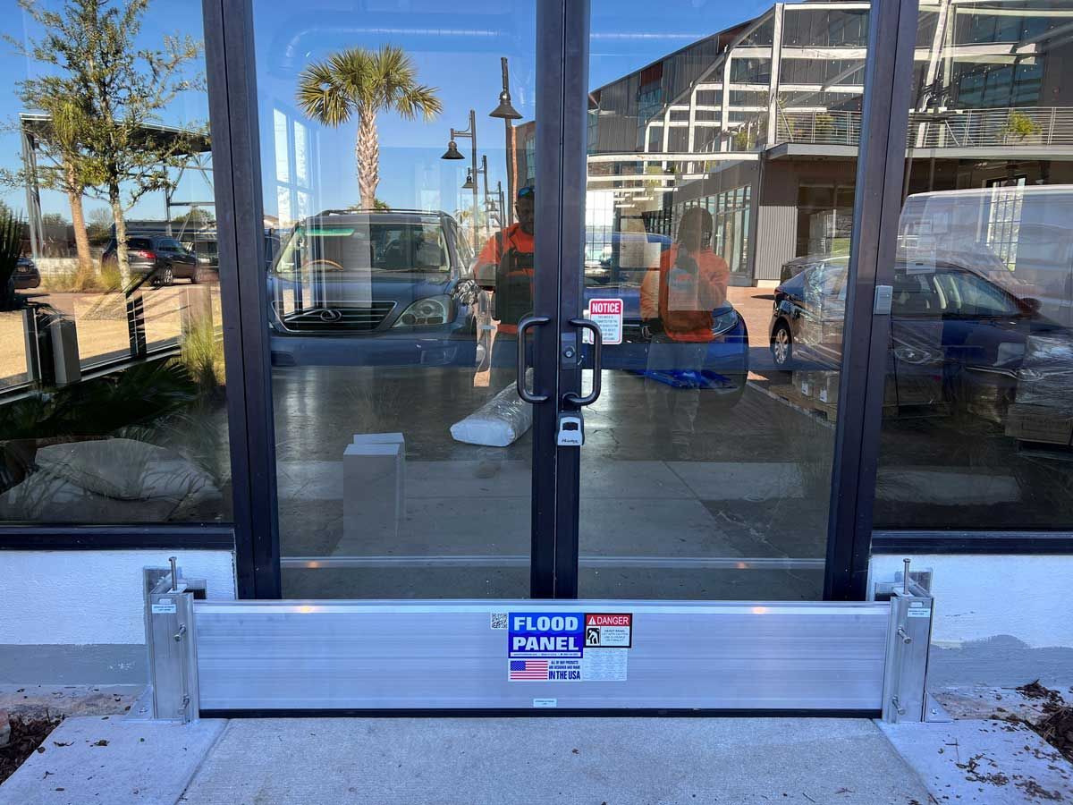A door with a flood barrier in front of it.