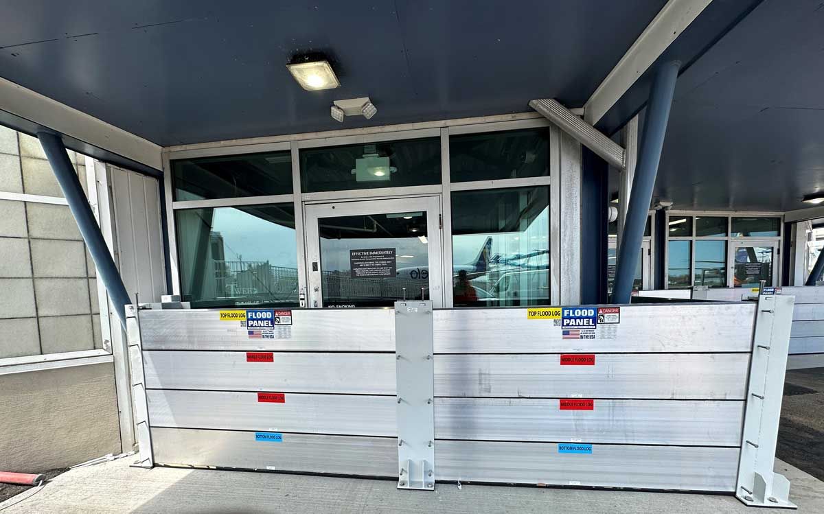 A building with a lot of windows and a barrier in front of it