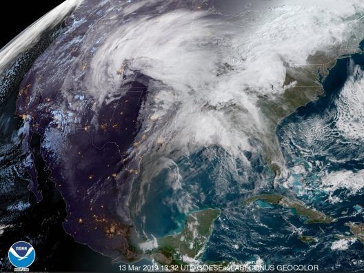 An aerial view of the earth showing clouds over the united states