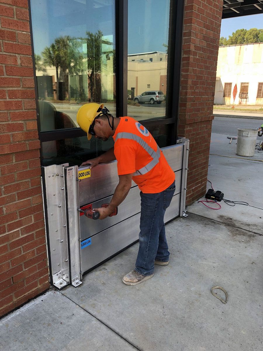 A man is measuring a door with a tape measure