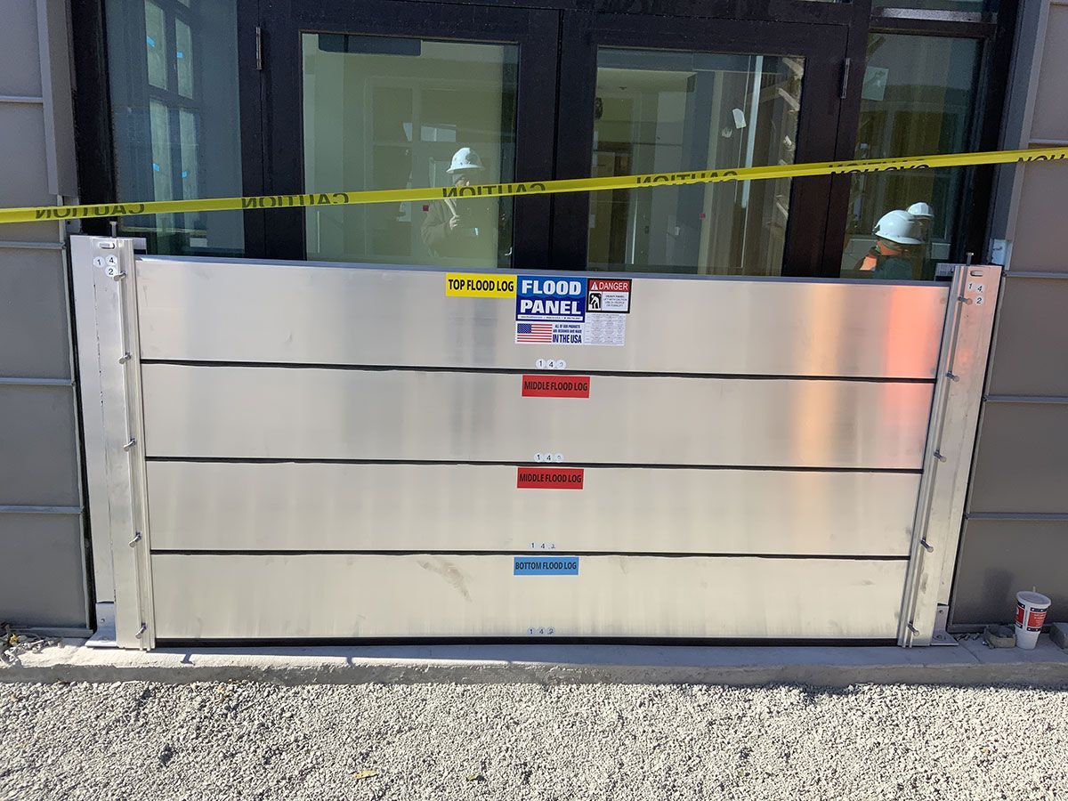 A flood barrier is sitting in front of a building.
