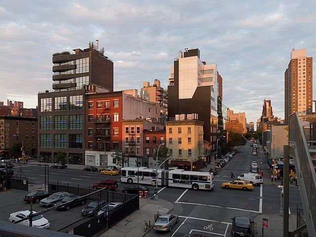 A city street with a lot of cars and buses on it