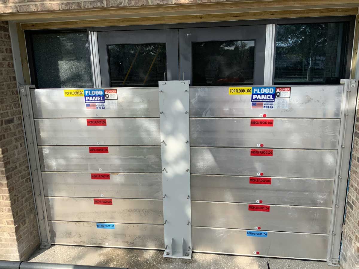 A garage door with a flood barrier attached to it.