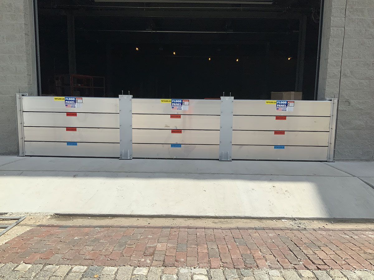A row of flood barriers in front of a building