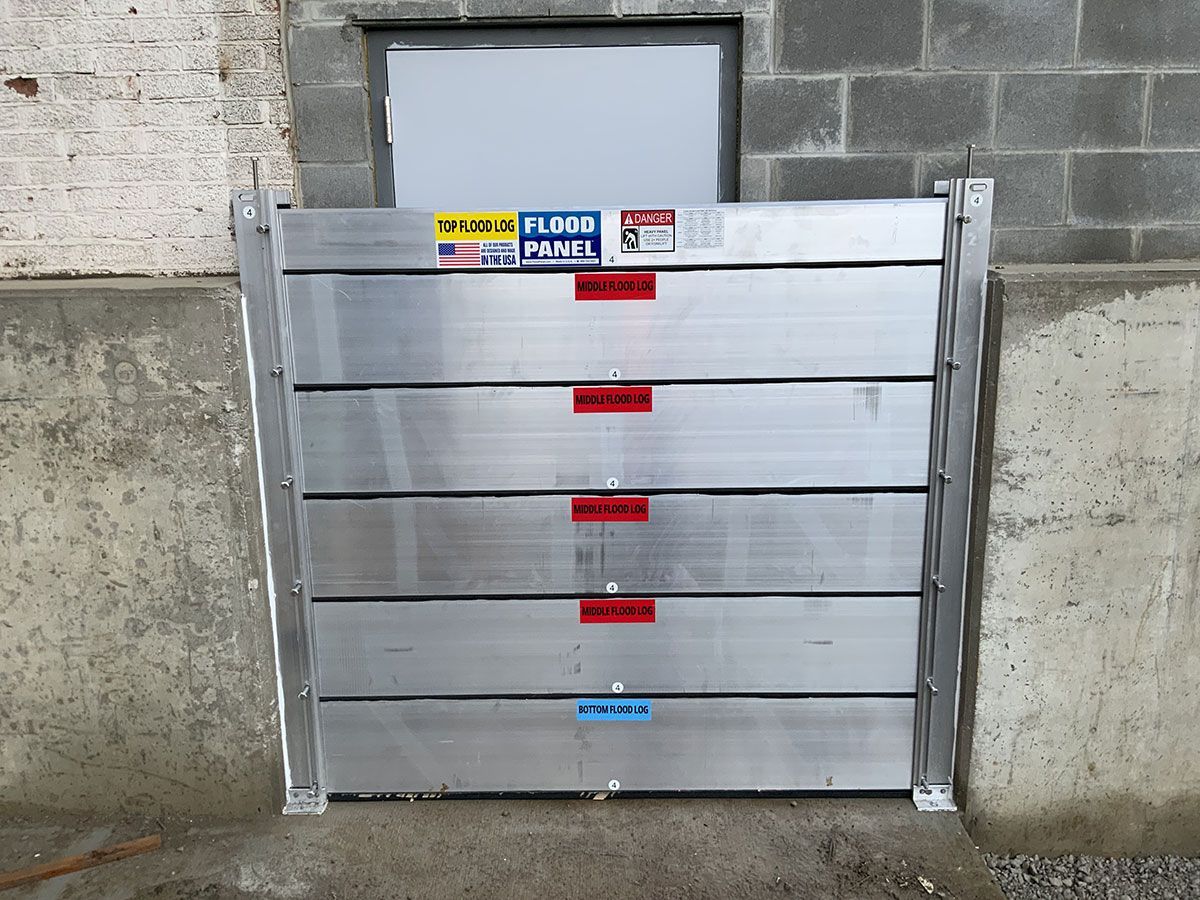 A flood barrier is sitting on the side of a building