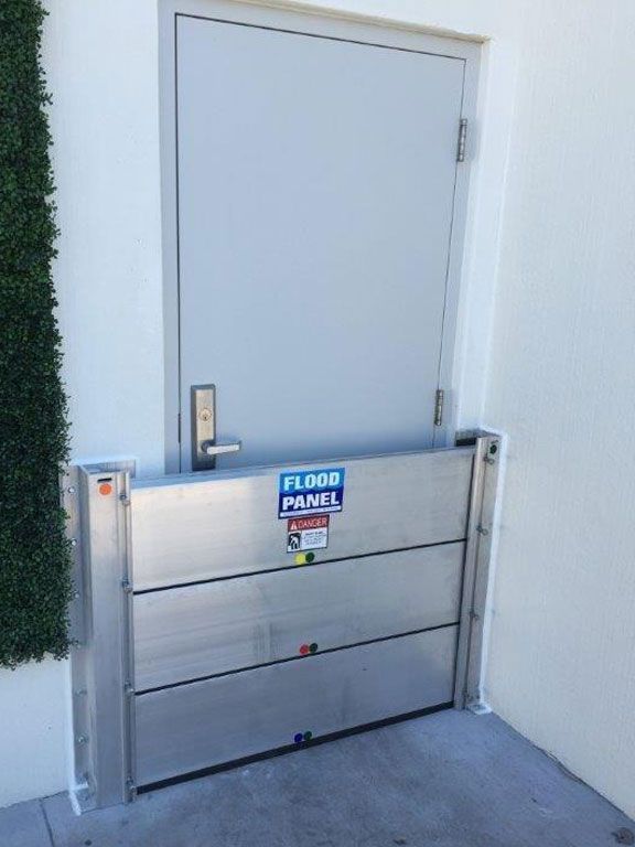 A door with a flood panel attached to it