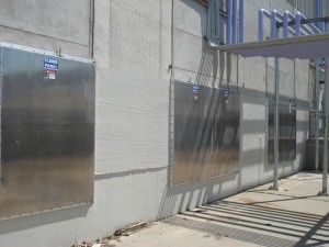 A building with stainless steel panels on the side of it.