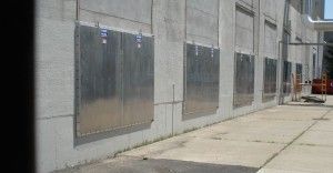 A row of stainless steel doors on the side of a building.