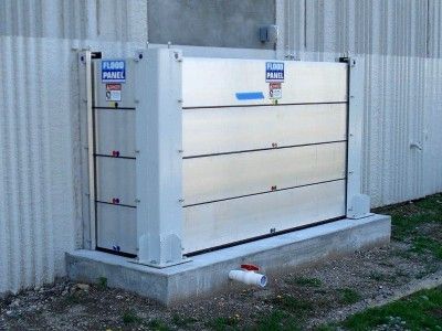 A flood barrier is sitting on the side of a building