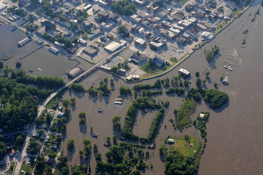 An aerial view of a city surrounded by flood waters