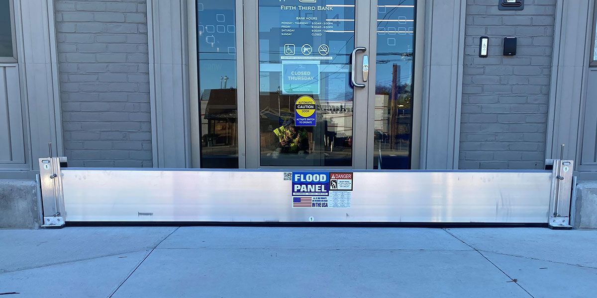 A flood barrier is sitting in front of a building.