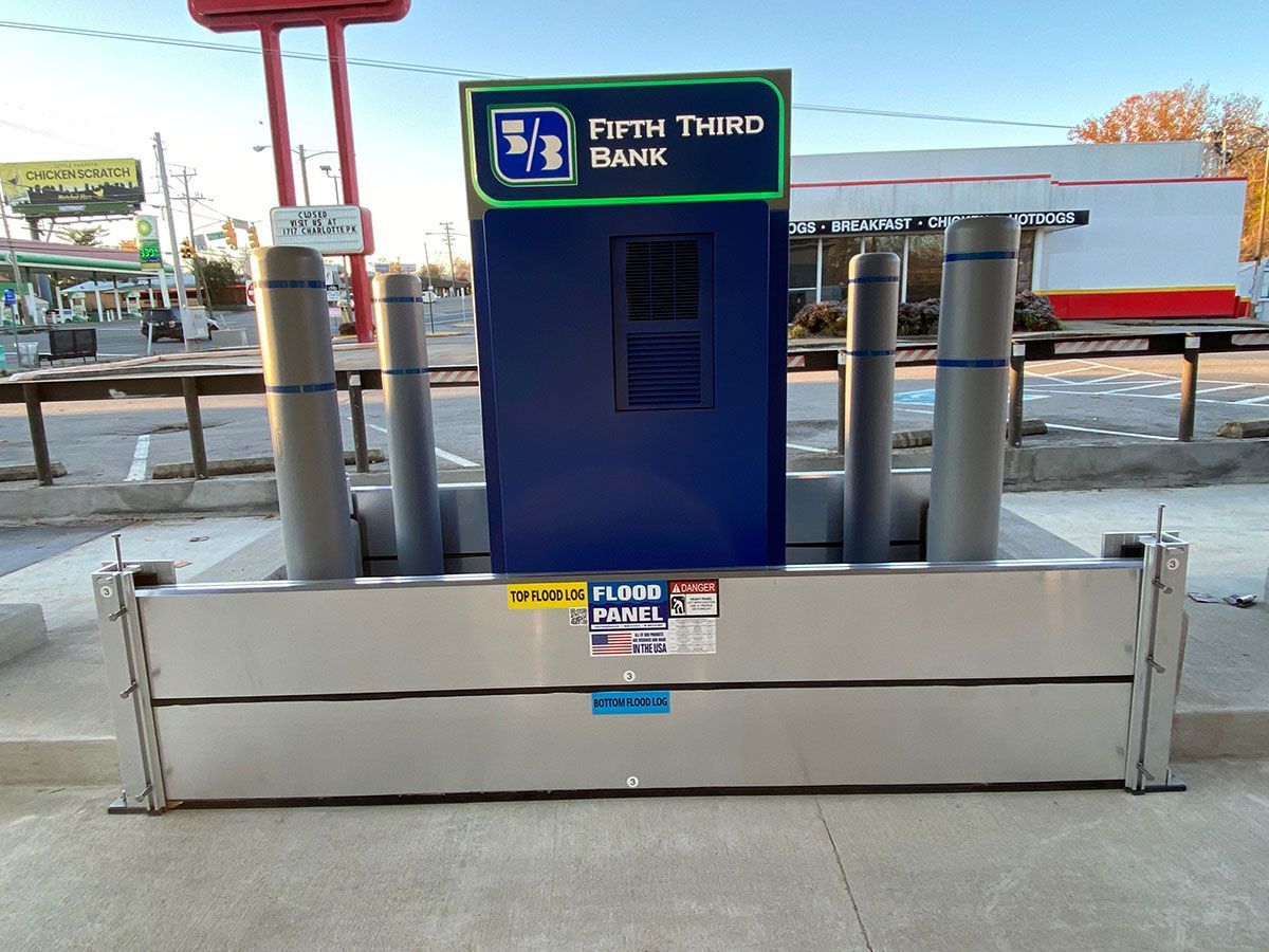 A fifth third bank sign is surrounded by metal poles