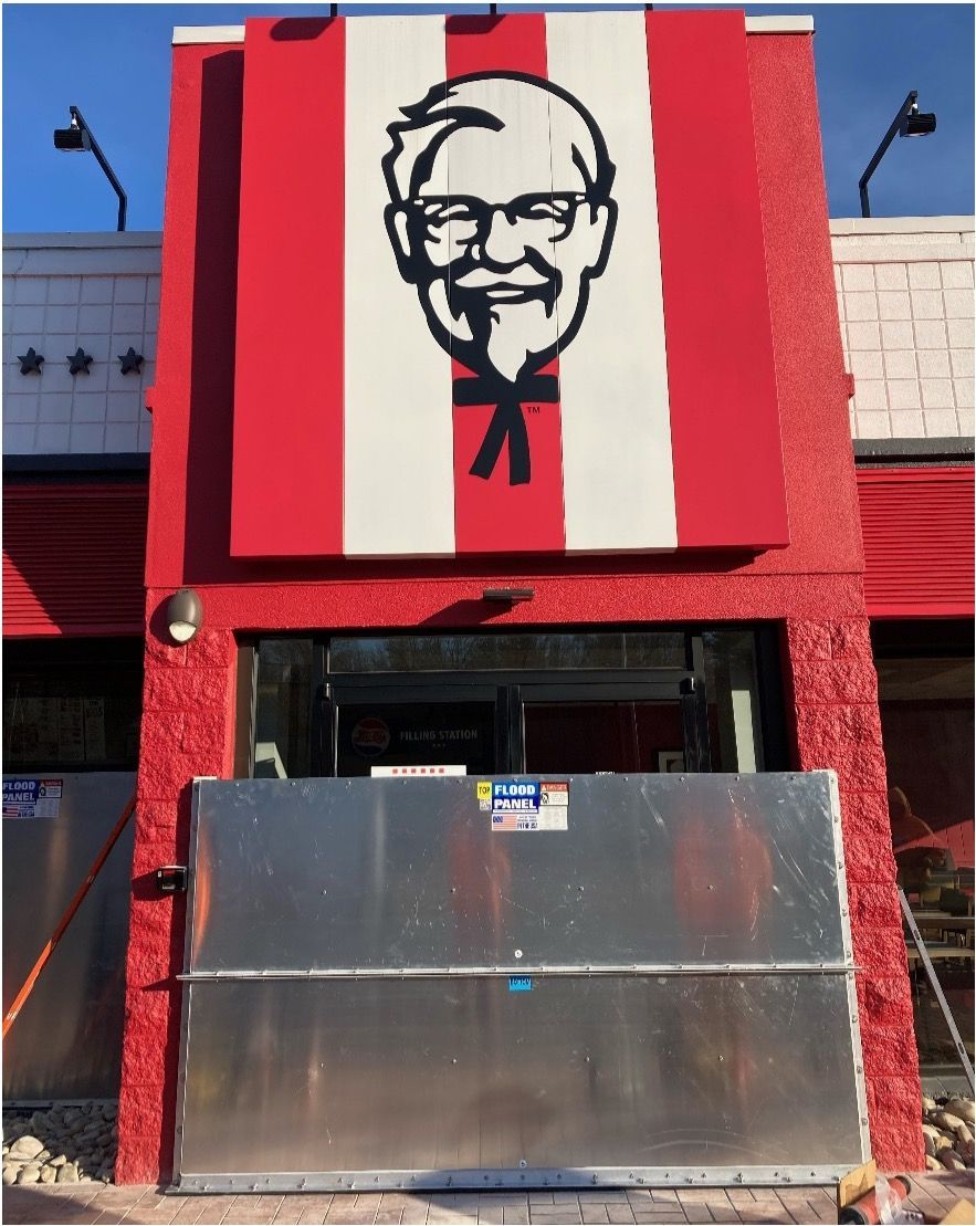 A kfc restaurant with a sign that says ' sr. kentucky fried chicken ' on it