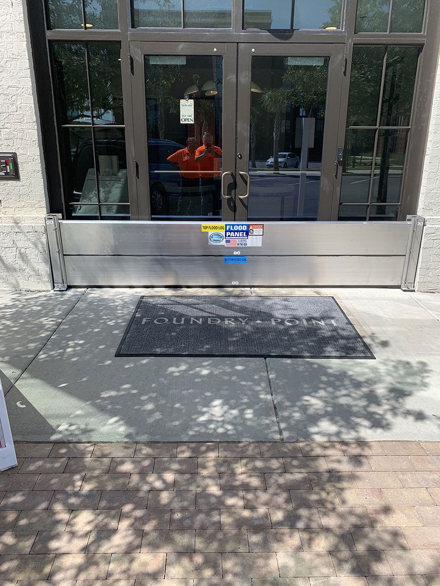 A door with a flood barrier in front of it.