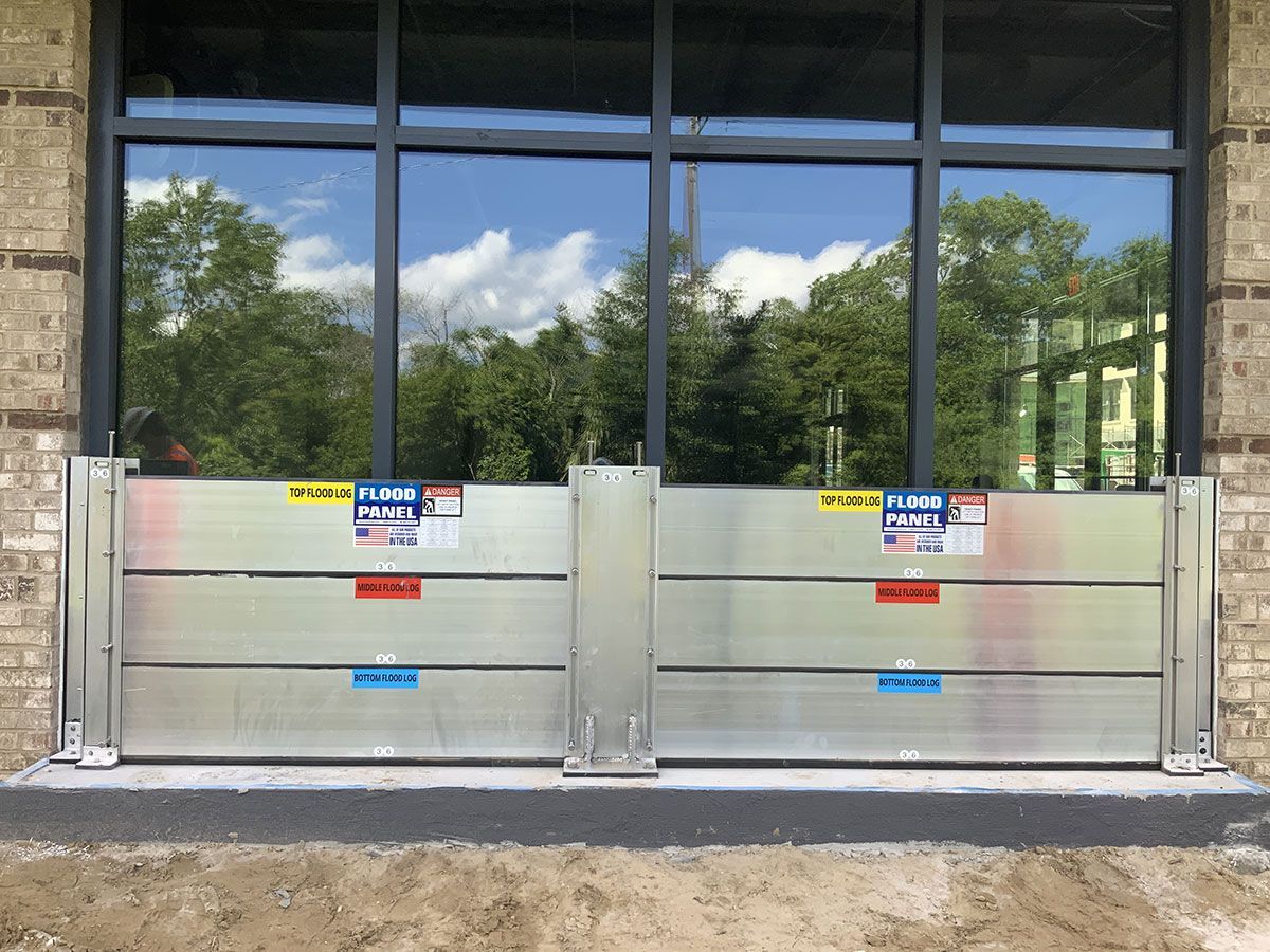 A large window with a flood barrier in front of it