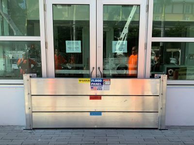 A flood barrier is sitting in front of a building.