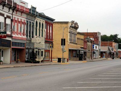 A row of buildings on the side of a street in a small town