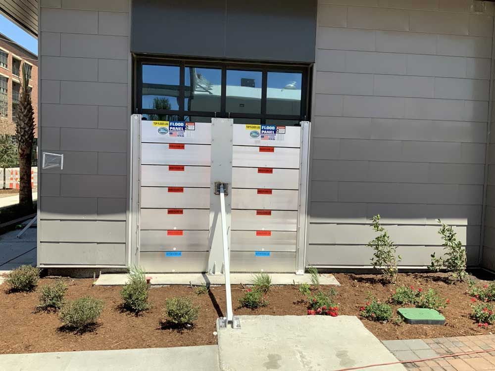 A gray building with a staircase leading up to it