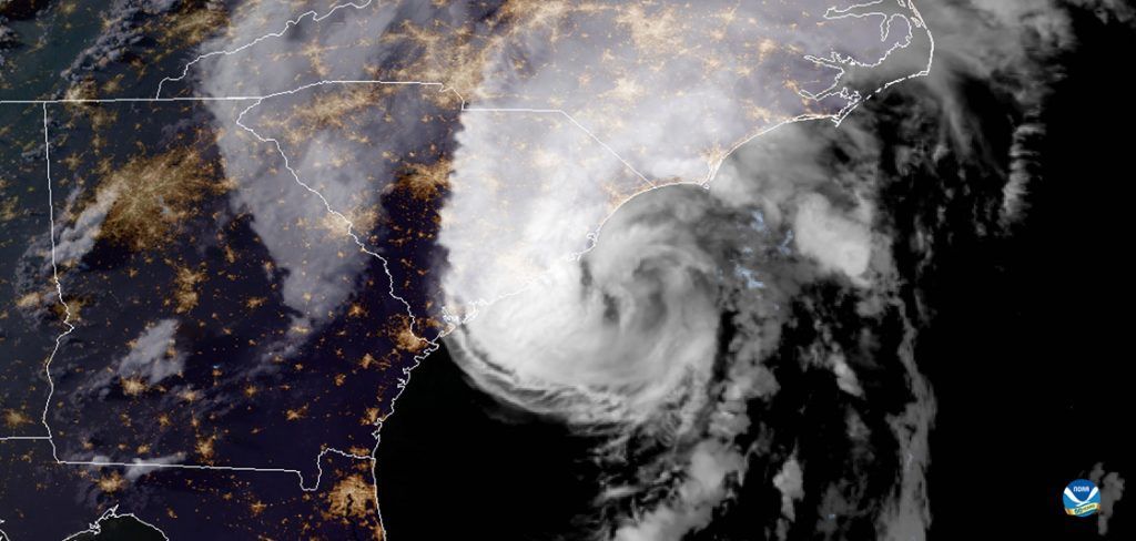 A satellite image of a hurricane in the middle of the ocean.