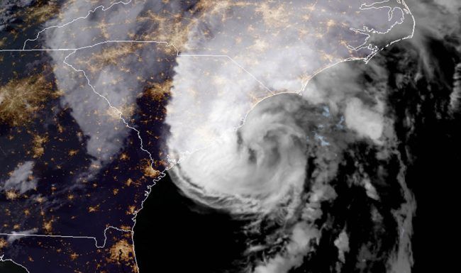 A satellite image of a hurricane in the middle of the ocean.