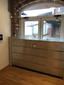 A room with a flood barrier in front of a window.