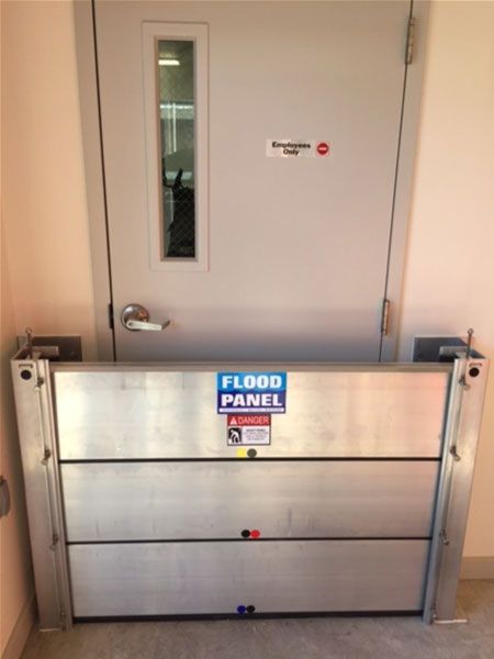 A door with a flood panel in front of it