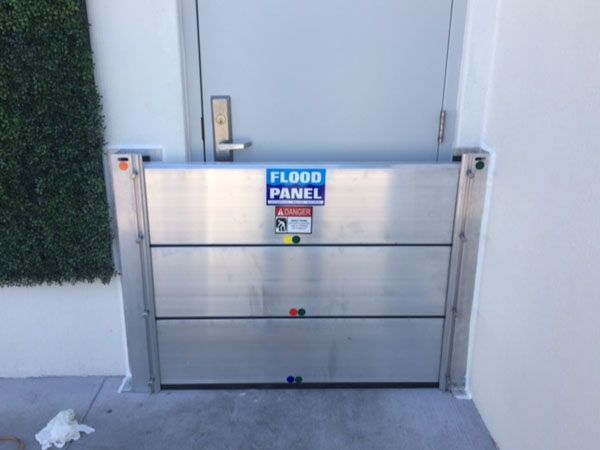 A flood panel is sitting in front of a door.
