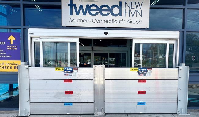 A building with a sign that says tweed new southern connecticut 's airport