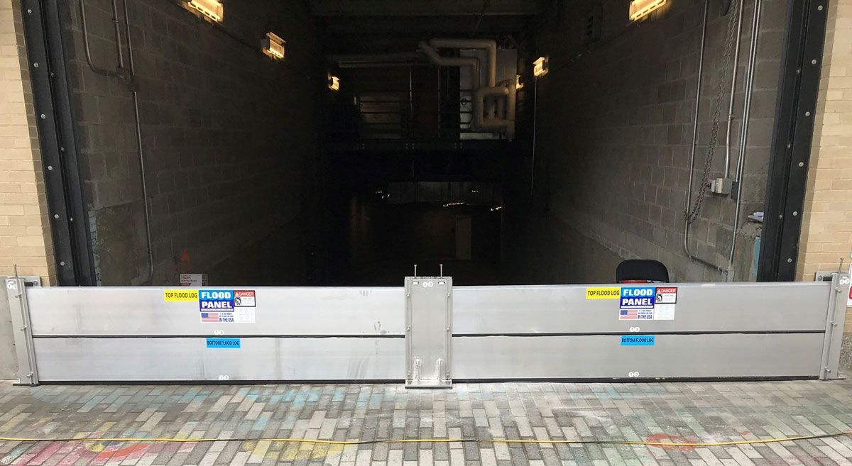There is a flood barrier in the doorway of a building.