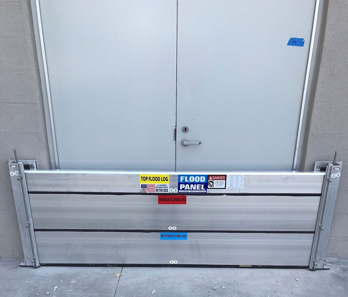 A door with a flood panel attached to it