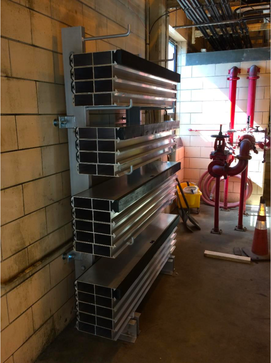 A bunch of metal pipes are stacked on top of each other