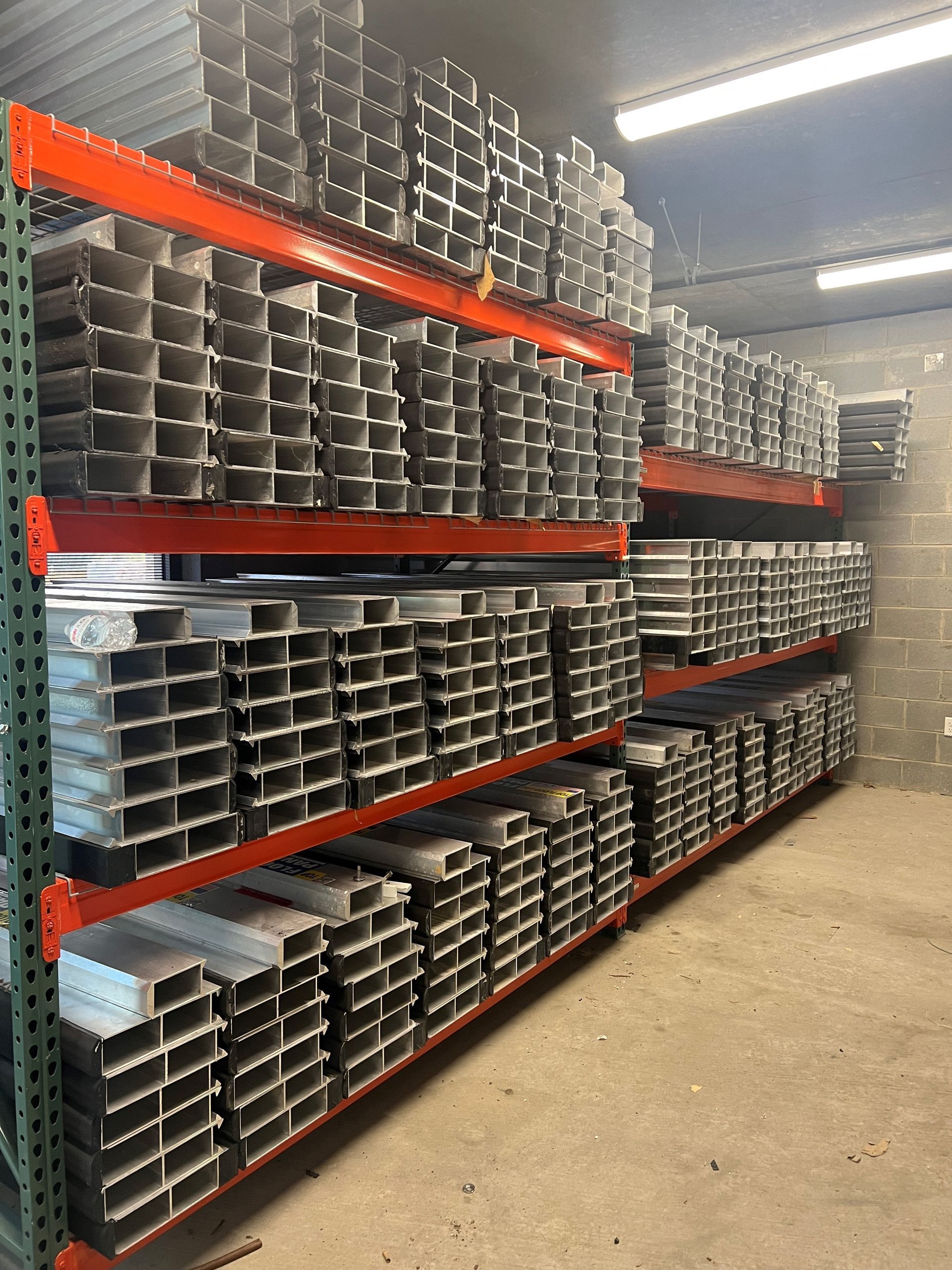 A warehouse filled with lots of metal shelves