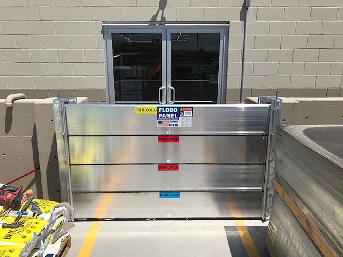 A flood barrier is in front of a store door