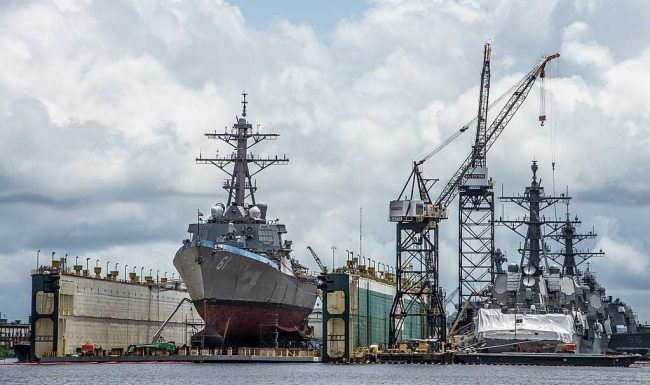 A large ship is being built in a shipyard.