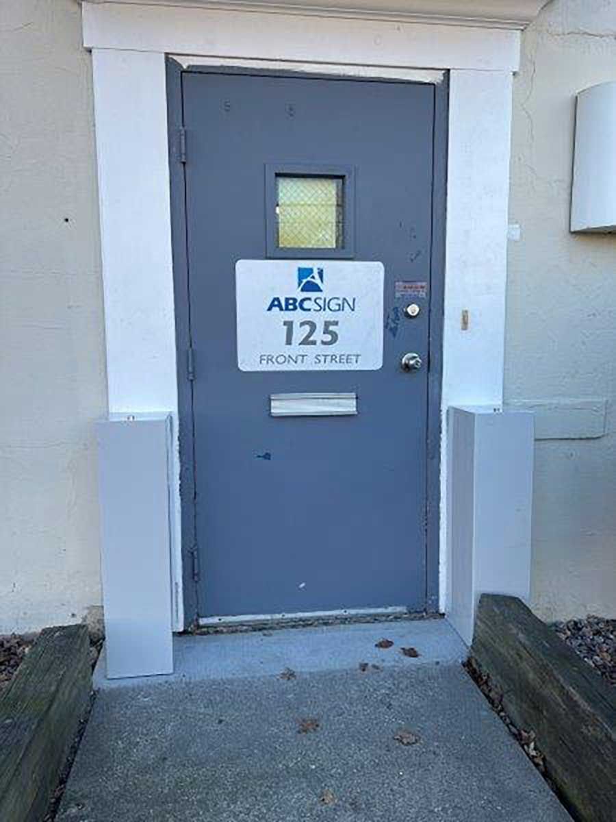 A door with a sign on it that says abc sign 125 right street