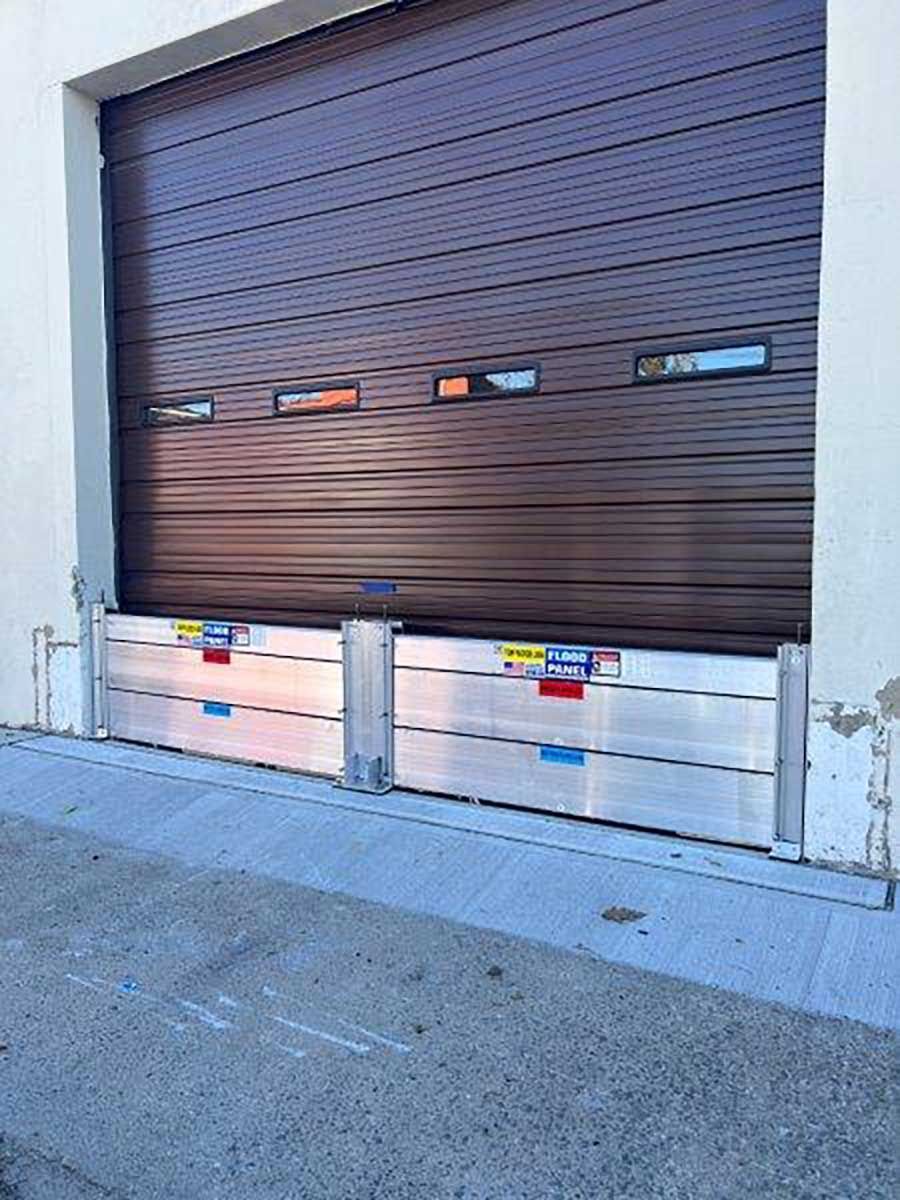 A garage door with a flood barrier attached to it.