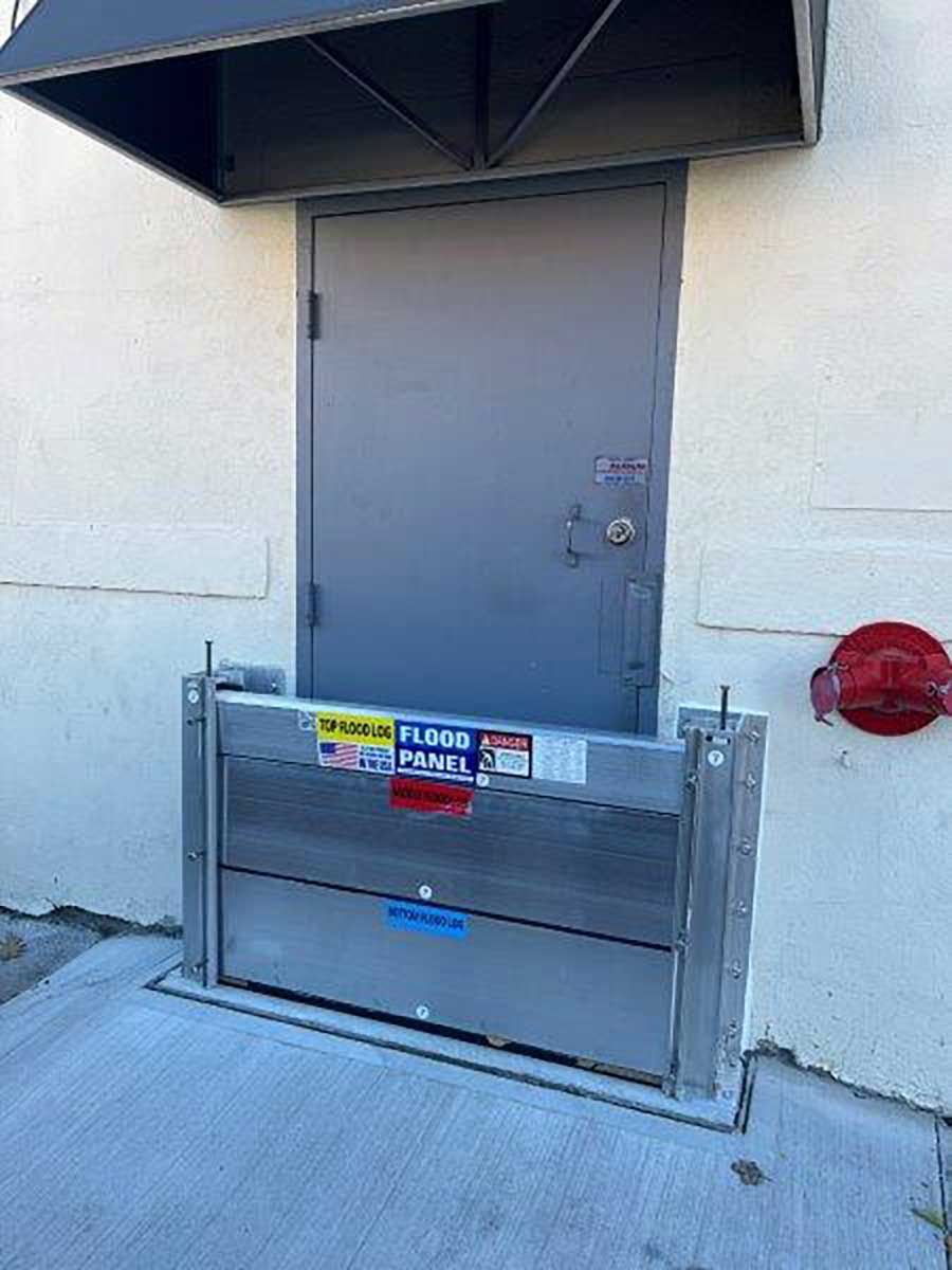 A door with a flood barrier attached to it.