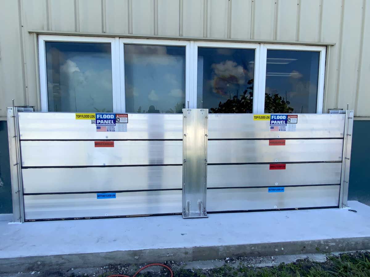 A flood barrier is attached to the side of a building